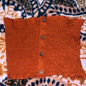 Burnt orange tube top ruffled with buttons down the middle